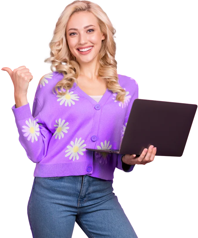 A girl standing and holding a laptop